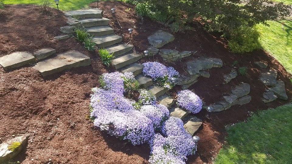 Stacked stone retaining wall and steps — Michiana hardscaping by Keyser